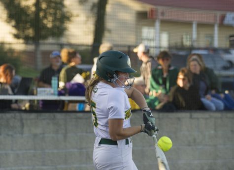 Freshman Kayla Mooney bats against Battle High School Oct. 17. The Bruins played their first post-season game against the Battle Spartans. The Lady Bruins next game will take place Oct. 19 at Hickman High School.