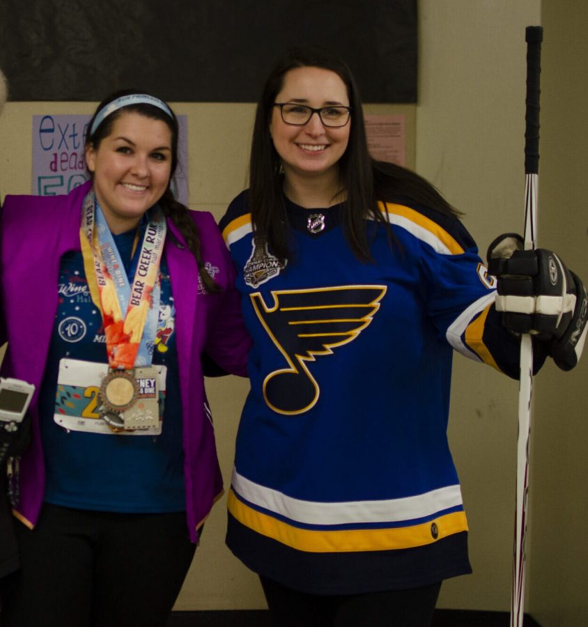 Teachers Carrie Stephenson and Abigail Gorsage showing athletic spirit as a marathon runner and hockey player. The art teachers plan to continue going all out for spirit week.  Tomorrow, they will both be country. Photo by Turner DeArmond.