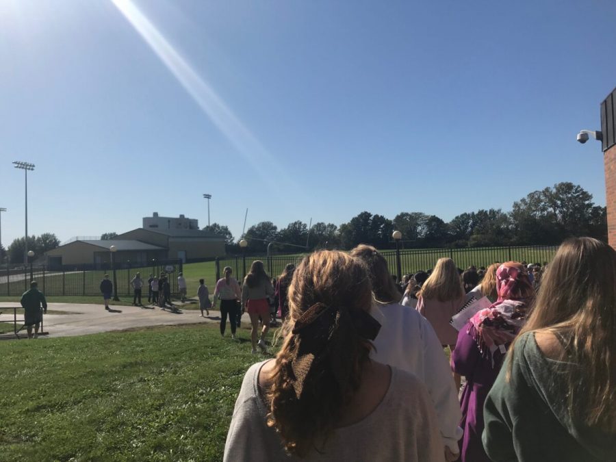 Students hurry out of the west exit during the first ALICE drill of the year, Oct. 2. Teachers were instructed to lead their students outside the building if the simulated threat was a safe distance away. This was the first of three active shooter drills to be conducted at RBHS.