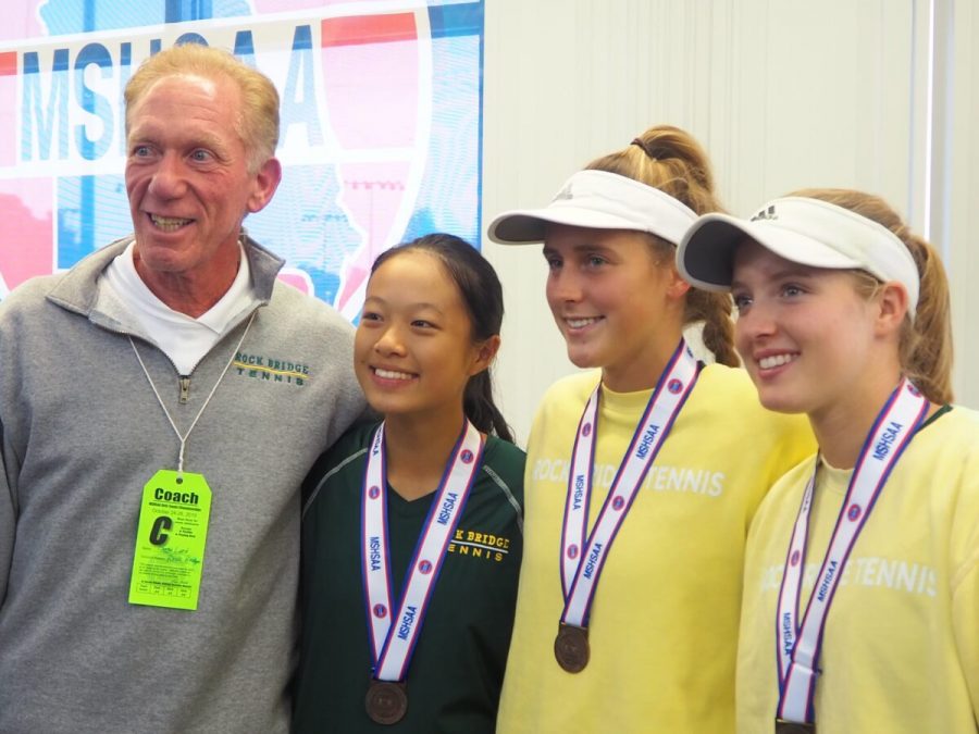 From left to right: coach Ben Loeb, sophomore Maggie Lin, senior Mary Frances Hose and senior Corine Farid pose for a picture during the awards ceremony at the girls tennis Class 2 State championships.