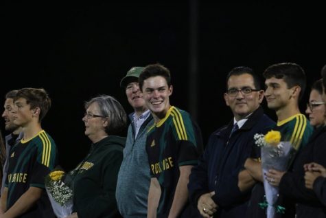 Seniors cant contain their happiness at senior night before their game on Oct. 15. Pictured from left to right: Zeke Lage (12), Matthrew Cathro (12), Sergio Pico (12). Photo by Grace Hervey.