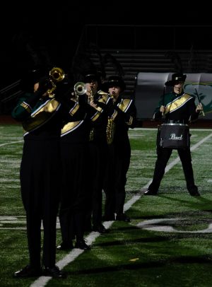 Members of the marching band perform a show at halftime of an RBHS football game. Photo by Parker Boone.