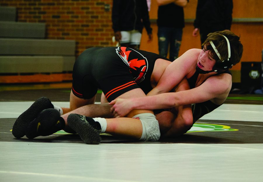 Sophomore Owen Twaddle wrestles during a competition Dec. 3. RBHS lost to Kirksville High School 30-48 but defeated Tolton Catholic High School 48-30. The team continues play in the Lee’s Summit Holiday invite today, beginning at 5 p.m. (Photo by Ana Manzano)