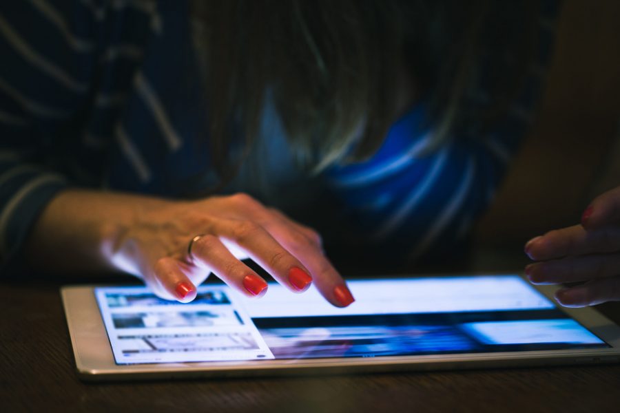 Close-up tablet computer in a woman hand. Photo from Envato Elements.