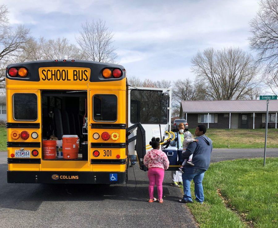 A bus from CPSs Grab-and-Go Meal Service delivers food at a designated stop. Photo courtesy of Michelle Baumstark.