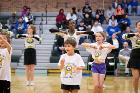 During the half-time of the JV Girls Basketball game, the Rock Bridge cheerleading team dance and cheer with the junior clinic.