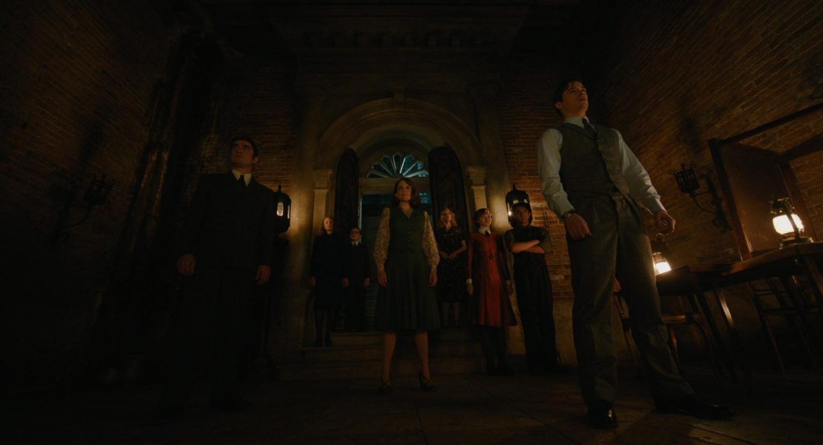 The suspects walk the threshold of the Venice mansion. Image courtesy of IMDb. 