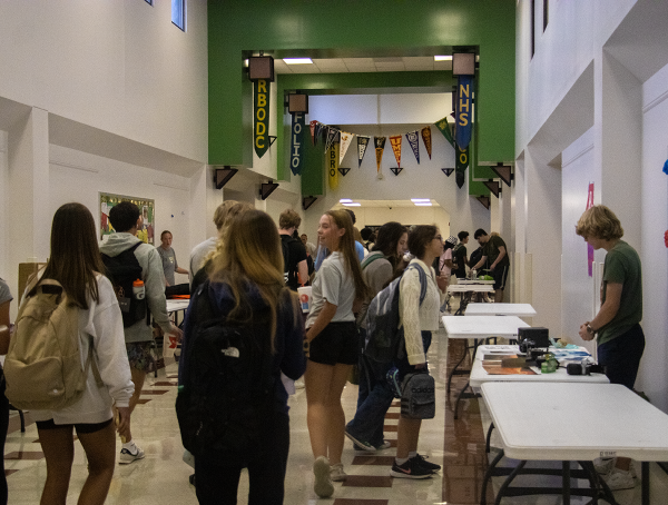 Students in the main hallway explore the various organizations represented at the Club Fair. 