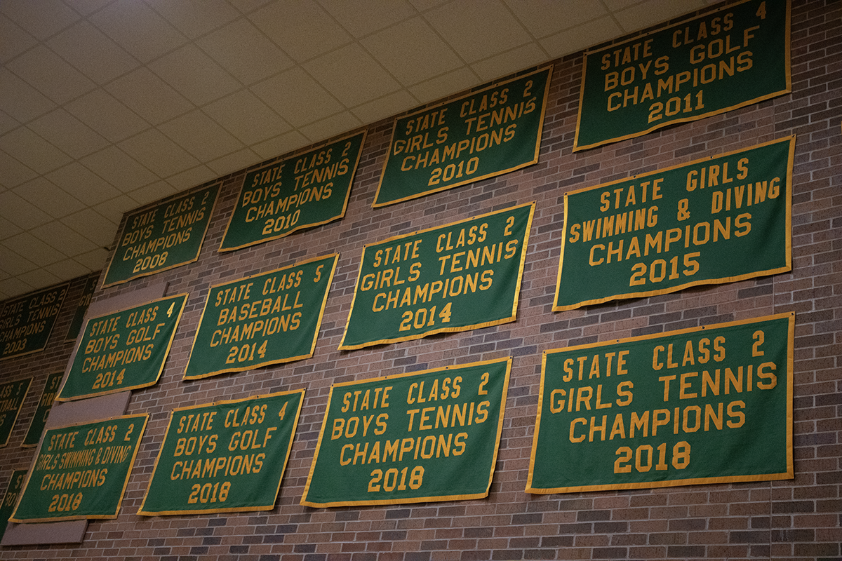 Various sports Award Banners from 2008-2018 for different sports including Tennis, Golf, Baseball, and Swimming.