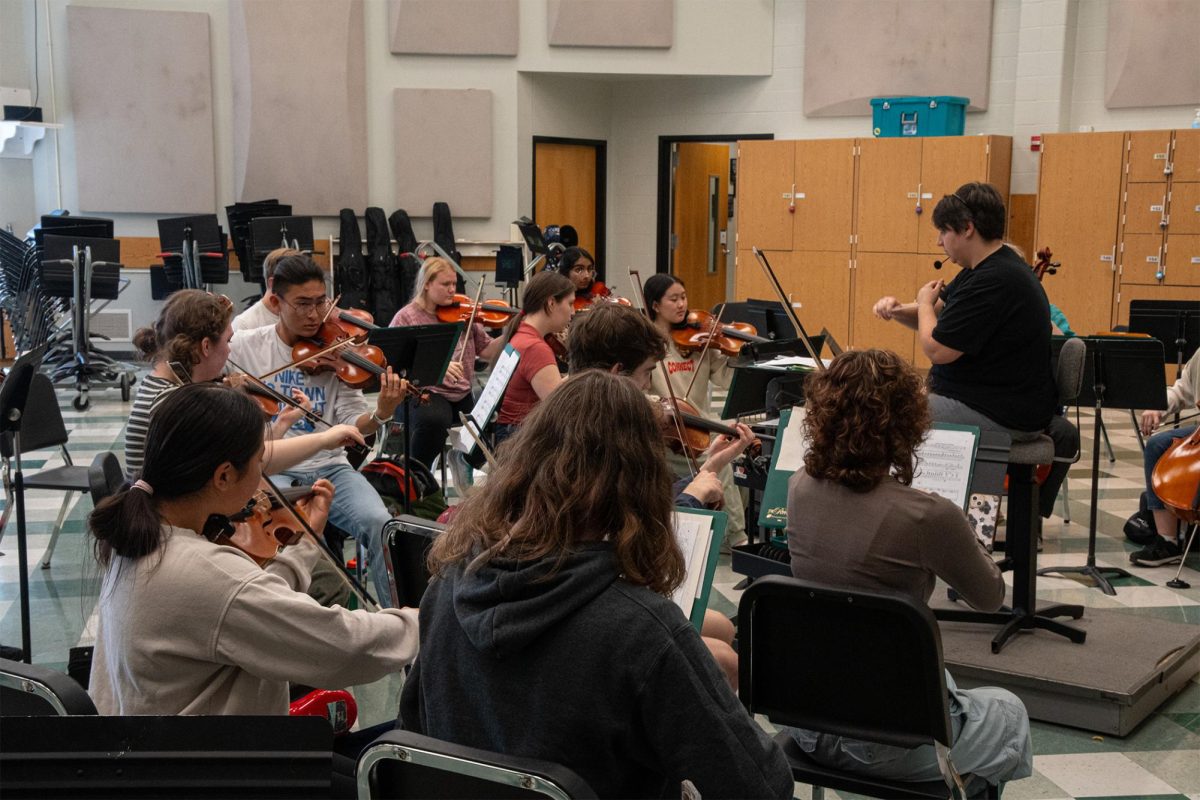 Alison Lankheit conducts Chamber Orchestra rehearsal in preparation for the first orchestra concert on Oct. 19. 