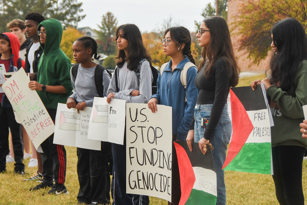 Photo of participants at the Free Palestine Rally holding posters advocating for US government support of Palestine. The Free Palestine Rally took place outside of the RBHS main entrance on Oct. 25.