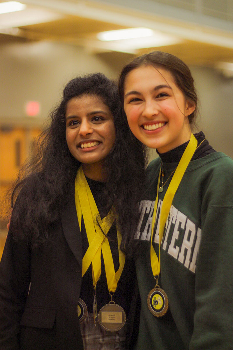 Jiya Shetty (11), and Kerra Lindbloom (11), recieve medals during award ceremony at Spartan Season Opener Debate tournament.