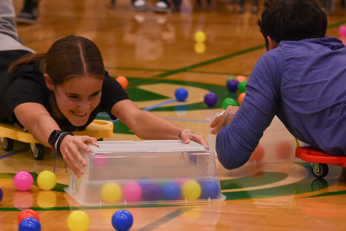 Alyssa Ritter (9) plays hungry hungry hippos at the Thanks assembly. 