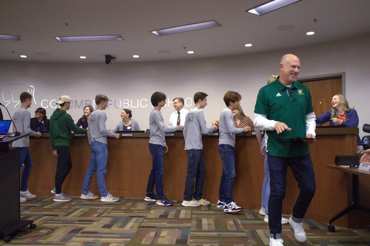 At the Dec. 11 BOE meeting, school board members congratulated the RBHS Cross Country team and Coach Neal Blackburn on their state championship.