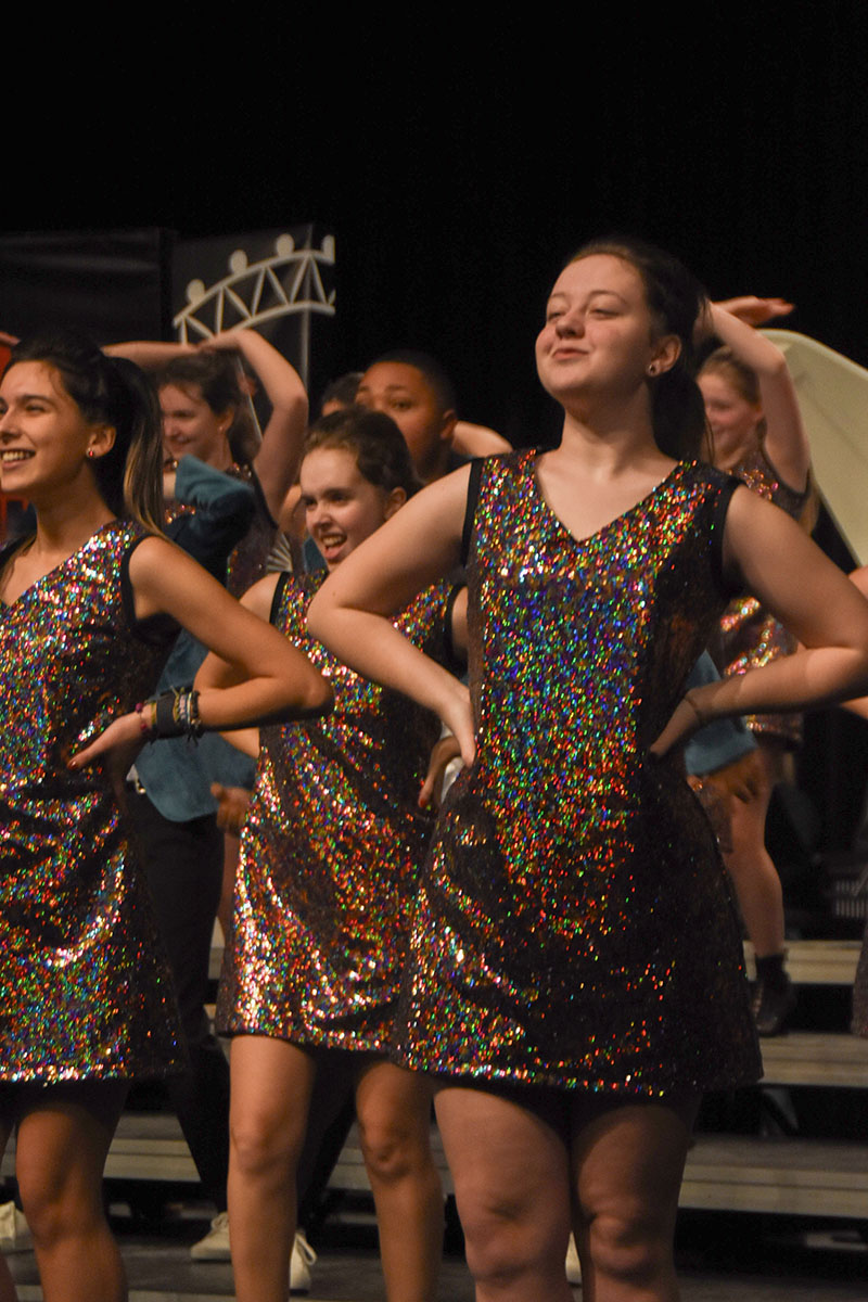 Emily Blake (11) sings and dances during the RBHS show choir performance. The show choir performance City Lights premiered Jan. 11 in the RBHS PAC.