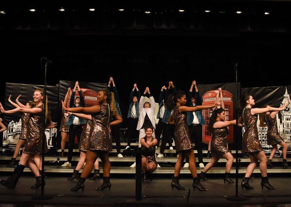 The RBHS Show Choir members strike their final pose concluding their City Lights opening performance on Jan. 11. This pose marks the end of the song Candle in the Wind/Saturday Night by Elton John featuring soloist Reid Fairlamb (11). 