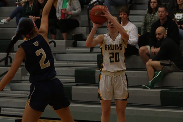 Squaring up for a three, senior Lexi Butts is looking to score the ball. The game ended in a 74-49 victory for the RBHS bruins over Helias on senior night.