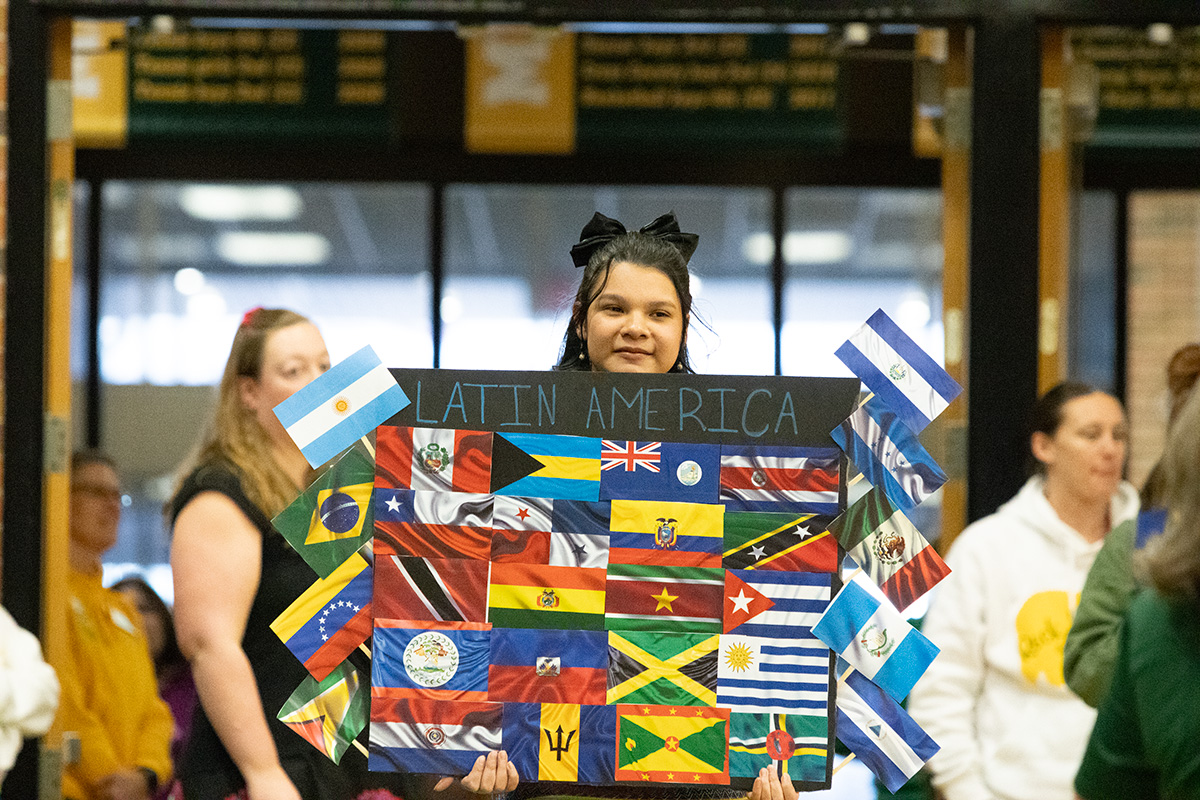 Photo of one of the Global Village posters showing flags from different Latin American countries. Global Village will take place Friday, March 8.
