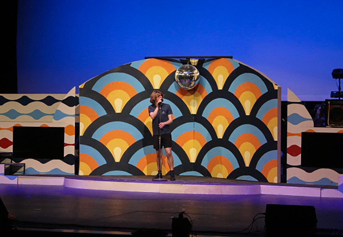 Reid Fairlamb (12) practices his solo for the upcoming school musical, Let it Be, during the April 30. dress rehearsal. 