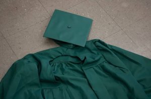 Photo of RBHS graduation cap and gown.
