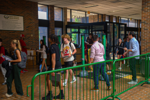 RBHS students walk through the new CPS weapons detection system to enter school.