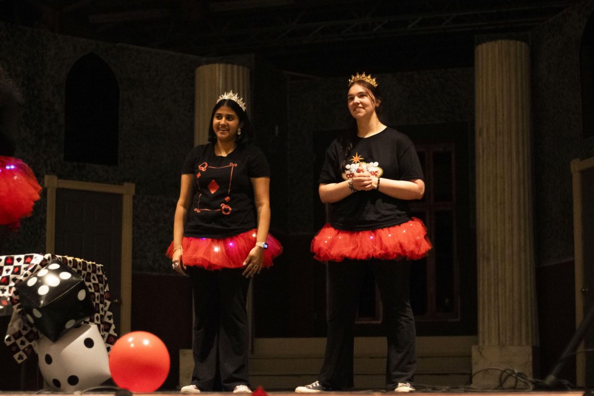 CPS Debate captains Aditi Patel (12) and Avery Johnson (12) smile on stage while presenting awards. The awards ceremony concluded COMO Classic, which ran from Jan. 31 to Feb. 1.