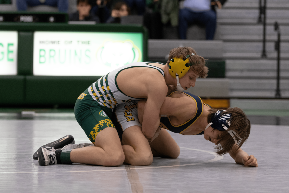 Henry Baker (9) circles around his BHS opponent to score a takedown. Photo by Ryan McClain