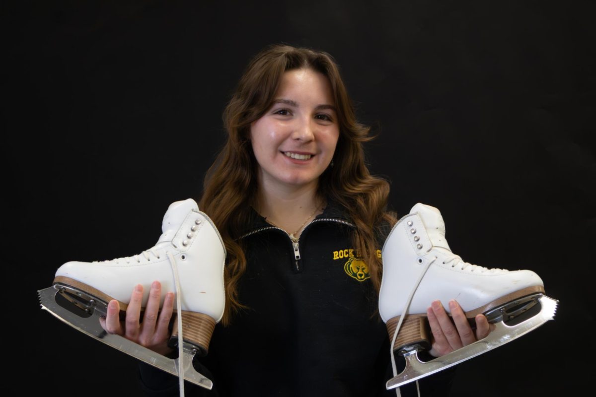Marguerite Flagg (12) poses with her ice skates. 