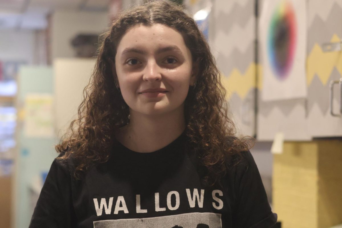 In the Art room at RBHS, Audrey Holliday (12) looks at a place she has spent 4 years in and made art she is most proud of. She has grown with the art she made in that room from freshman year, she made many inspiring art pieces in that room. “I have a piece called The Machinist,” Holliday said. “Which is a pastel drawing that I think reflects me because it's a self portrait.”