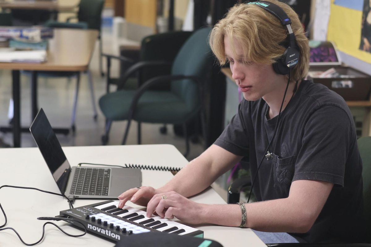 Adding notes into his song, Senior Noah James plays his keyboard to add the final touches.. James focuses on creating music inspired by the music he listens to. “I think it's a concept in jazz, like sort of stealing ideas from others, even though it's like the idea of stealing sounds wrong, like we're all influenced by the art we listen to.” Said James. “So for me, this song in particular, it's very much inspired by TV Girl and that kind of sound.” 