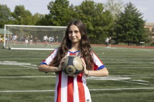 Waiting for soccer practice to start, Marta Pezuela (12), has never played soccer before her sophomore year. Transferring from Spain, Pezuela watched soccer a lot, but never played because it wasn’t popular at her school. “No, [club sports] [don’t] exist. If you do a sport, it needs to be with your school, but no one really does sports [in Spain].”